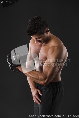 Image of Muscular man lifting weights