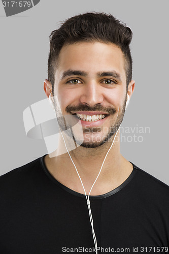 Image of Man smiling and listen music