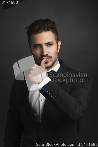 Image of Latin man wearing a tuxedo