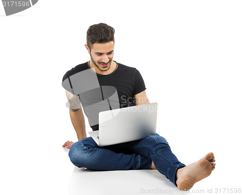 Image of Man working with a laptop