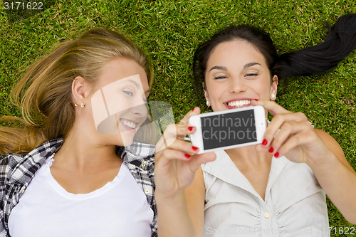 Image of Best friends taking selfies