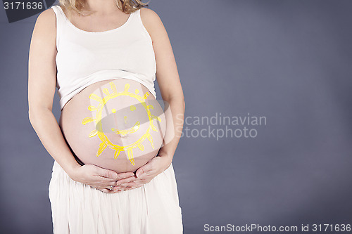 Image of Drawn sun on baby bump