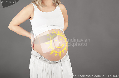 Image of Baby belly with sun