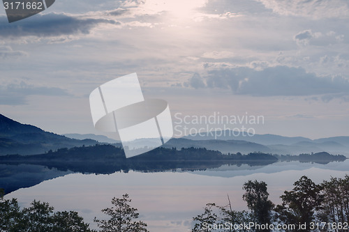 Image of Hazy Sunrise in mountain lake