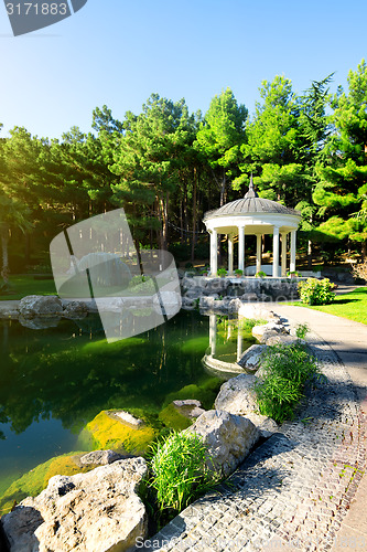 Image of White arbour near lake