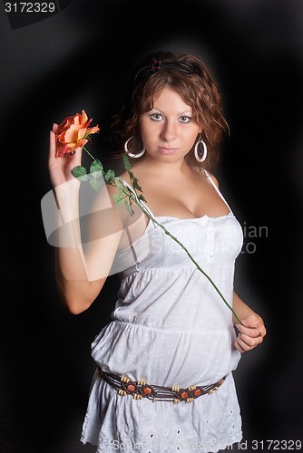 Image of Beautiful woman with flower