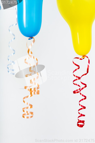 Image of Balloons of different bright colors on a white background