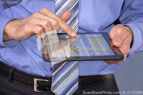 Image of Businessman using tablet