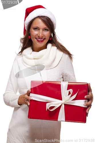 Image of Pretty woman in a Santa hat with a large gift