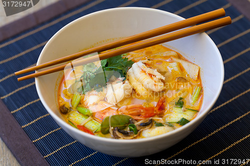 Image of Bowl of traditional Thai tom yam soup