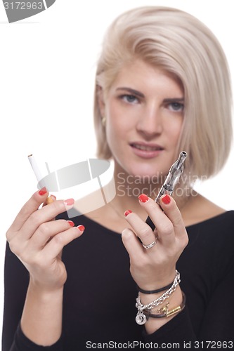 Image of Blond Woman Holding a Tobacco and E-Cigarette