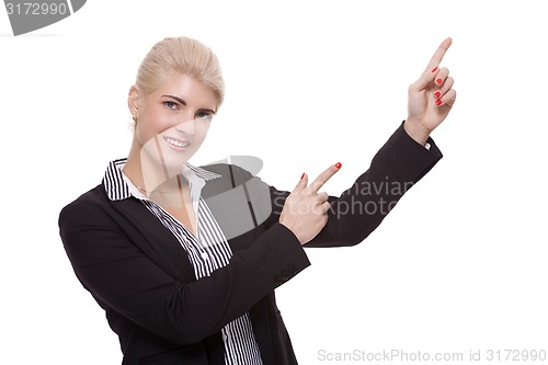 Image of Businesswoman Pointing Up While Looking at Camera