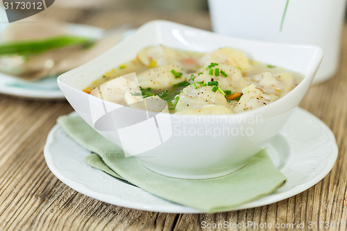 Image of Dish of savory pork tortellini in broth pelmeni russian