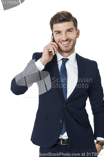 Image of Stylish businessman chatting on his mobile