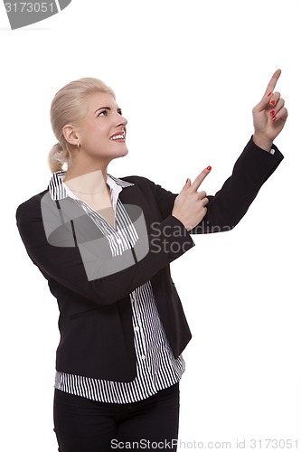 Image of Businesswoman Pointing Up While Looking at Camera