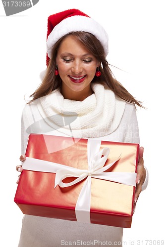 Image of Pretty woman in a Santa hat with a large gift