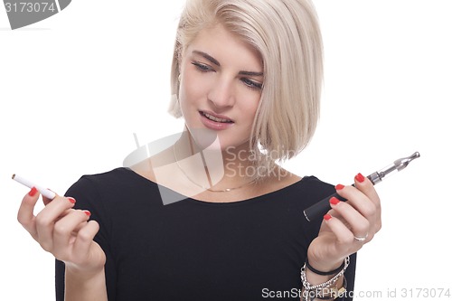 Image of Blond Woman Holding a Tobacco and E-Cigarette