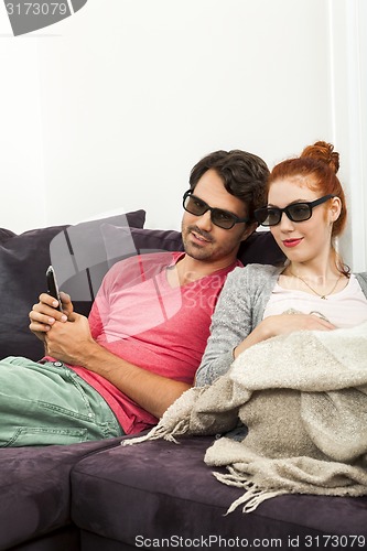 Image of Sweethearts with 3d glasses Resting on the Sofa