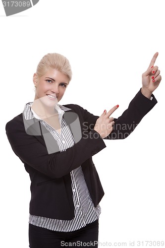 Image of Businesswoman Pointing Up While Looking at Camera