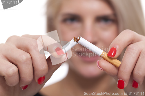 Image of Close up Young Woman Breaking a Cigarette Stick