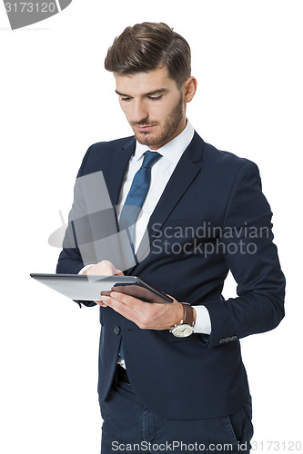 Image of Businessman using a tablet computer