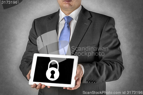 Image of Businessman with tablet computer and padlock