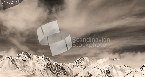 Image of Sepia winter mountains in fog