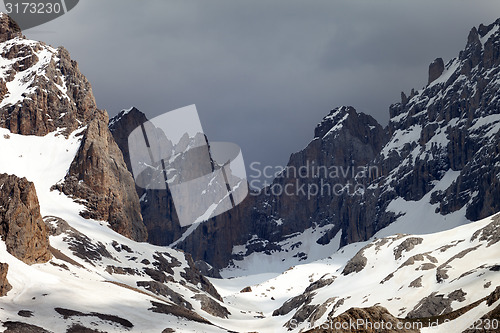 Image of Snowy mountains and storm clouds