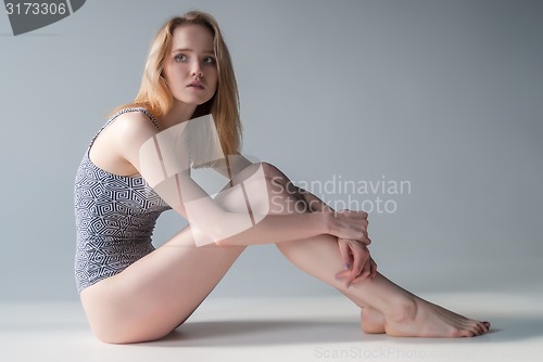 Image of Attractive girl in swimming suit