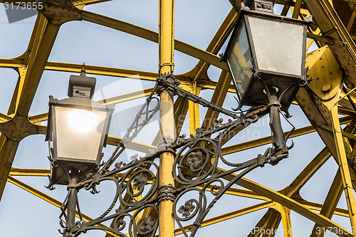 Image of Decorative lamps hanging from bridge