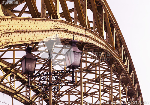 Image of Decorative lamps hanging from bridge