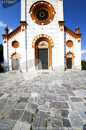 Image of  church  in    mercallo   closed brick tower sidewalk italy  lom