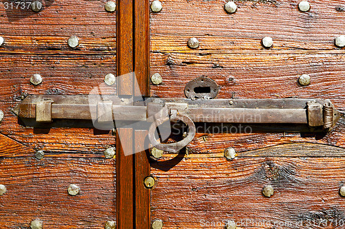 Image of italy  patch lombardy     rusty  curch  closed wood