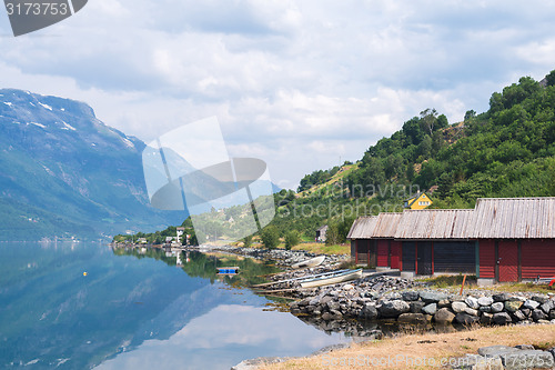 Image of Red boat-houses at th shore of fjord