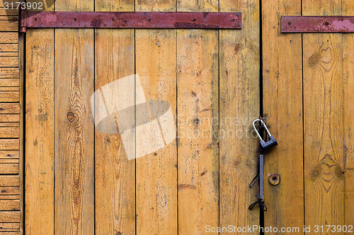 Image of Wooden door with a padlock