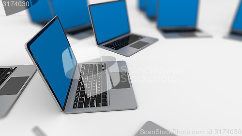 Image of 3d render of a lot of laptops in a row. 