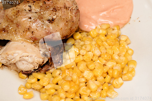 Image of grilled chicken with corn and hot sauce