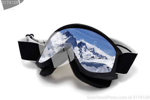 Image of Ski goggles with reflection of winter mountains