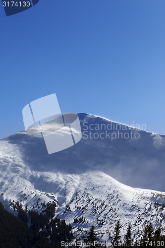 Image of Winter mountains in sunny wind day