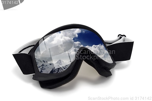 Image of Ski goggles with reflection of cloudy mountains