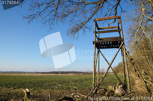 Image of Hunting tower by a field