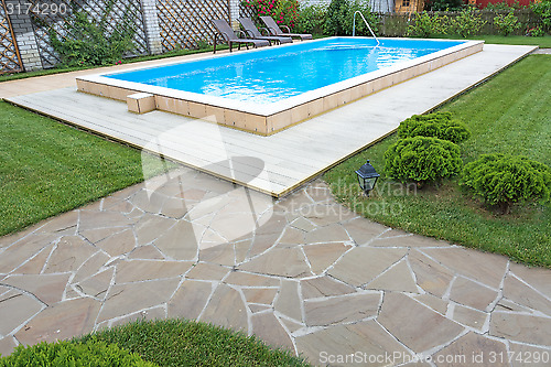 Image of Swimming pool in the yard of a private home.