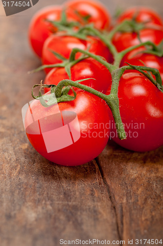 Image of fresh cherry tomatoes on a cluster
