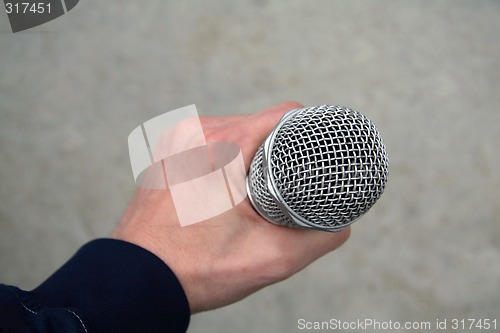 Image of mic in hand