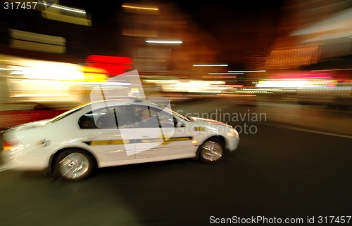 Image of taxi in motion