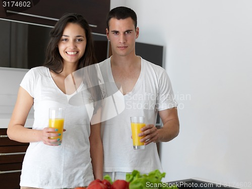 Image of happy young couple in kicthen