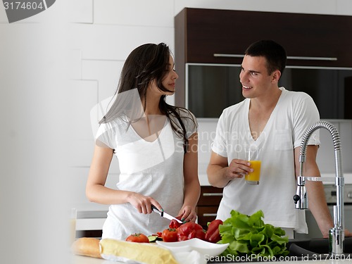 Image of happy young couple in kicthen