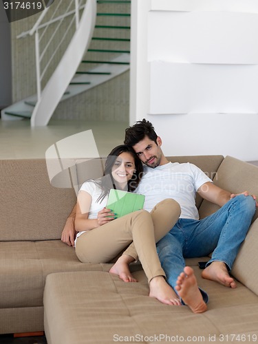 Image of young couple making selfie together at home