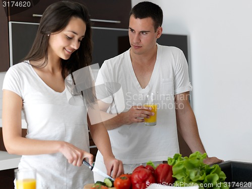 Image of happy young couple in kicthen