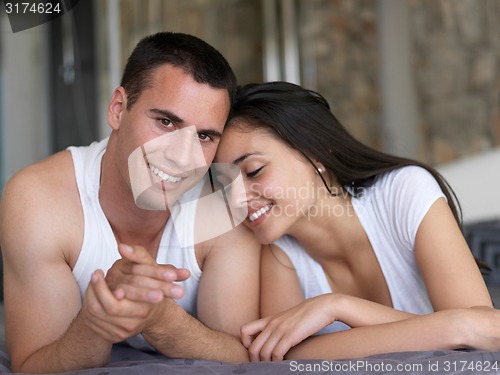 Image of couple relax and have fun in bed